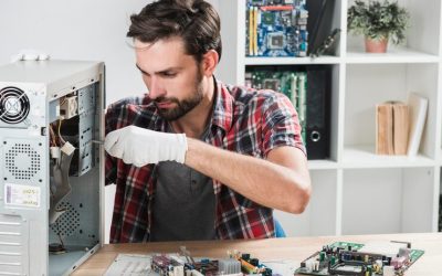 portrait-male-technician-repairing-computer